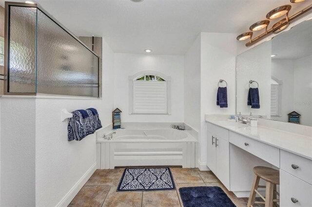 474 Lomond Dr, Port Charlotte, FL 33953 - full bath with baseboards, a garden tub, vanity, and a walk in shower