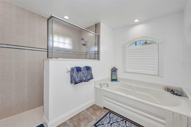 474 Lomond Dr, Port Charlotte, FL 33953 - bathroom with walk in shower, a bath, tile patterned floors, recessed lighting, and baseboards