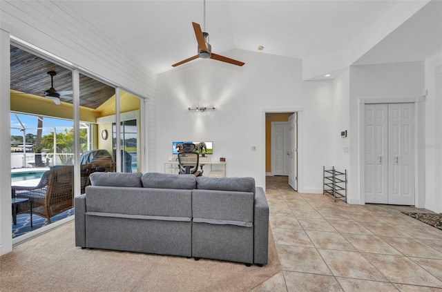 474 Lomond Dr, Port Charlotte, FL 33953 - living room featuring a ceiling fan, lofted ceiling, tile patterned flooring, baseboards, and a sunroom