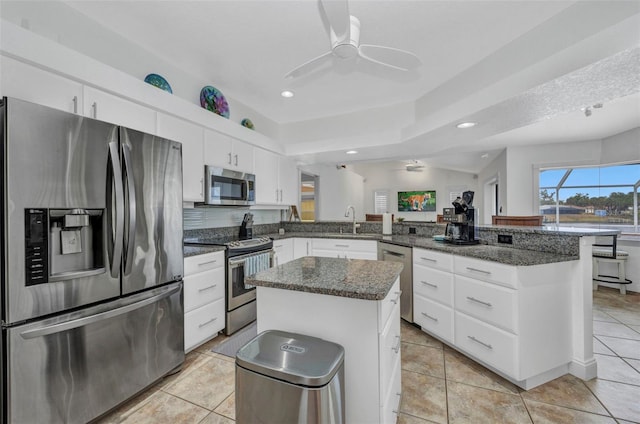 474 Lomond Dr, Port Charlotte, FL 33953 - kitchen featuring appliances with stainless steel finishes, a peninsula, ceiling fan, a sink, and recessed lighting