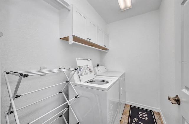 474 Lomond Dr, Port Charlotte, FL 33953 - washroom with separate washer and dryer, cabinet space, and baseboards
