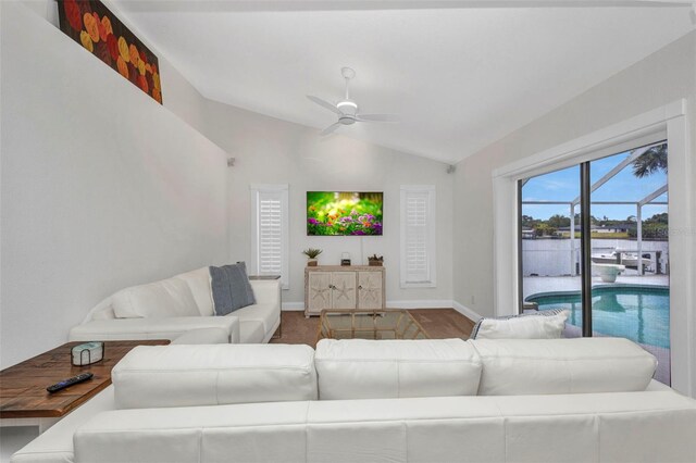 474 Lomond Dr, Port Charlotte, FL 33953 - living area with lofted ceiling, a ceiling fan, baseboards, and wood finished floors
