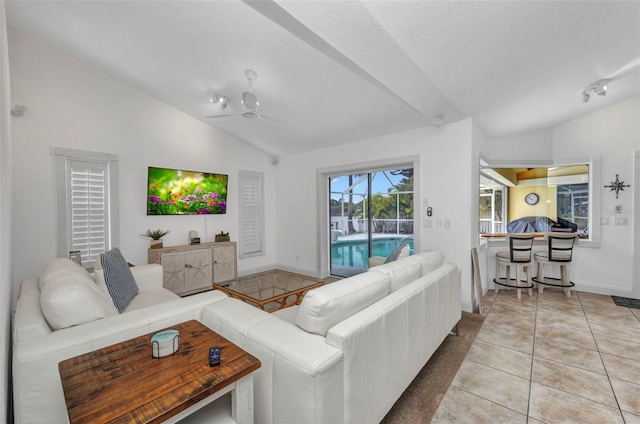 474 Lomond Dr, Port Charlotte, FL 33953 - living room with lofted ceiling, a ceiling fan, baseboards, and tile patterned flooring