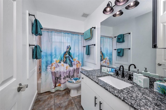 474 Lomond Dr, Port Charlotte, FL 33953 - full bathroom featuring toilet, vanity, shower / bath combo, tile patterned floors, and baseboards