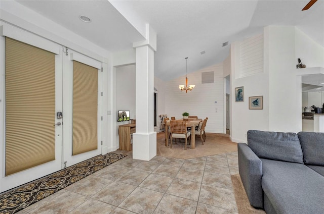 474 Lomond Dr, Port Charlotte, FL 33953 - living area with a chandelier, french doors, light tile patterned flooring, and high vaulted ceiling