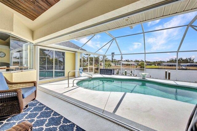 474 Lomond Dr, Port Charlotte, FL 33953 - outdoor pool featuring a patio, a lanai, and a water view