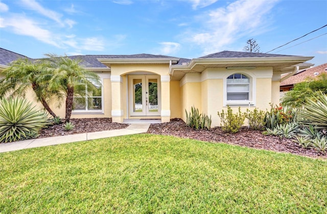 474 Lomond Dr, Port Charlotte, FL 33953 - doorway to property featuring stucco siding, a yard, french doors, and roof with shingles