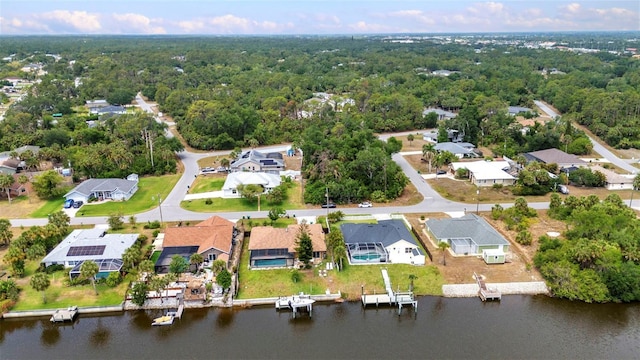 474 Lomond Dr, Port Charlotte, FL 33953 - aerial view of property and surrounding area with nearby suburban area, a heavily wooded area, and a large body of water