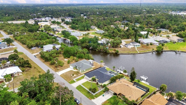 474 Lomond Dr, Port Charlotte, FL 33953 - aerial perspective of suburban area with a large body of water