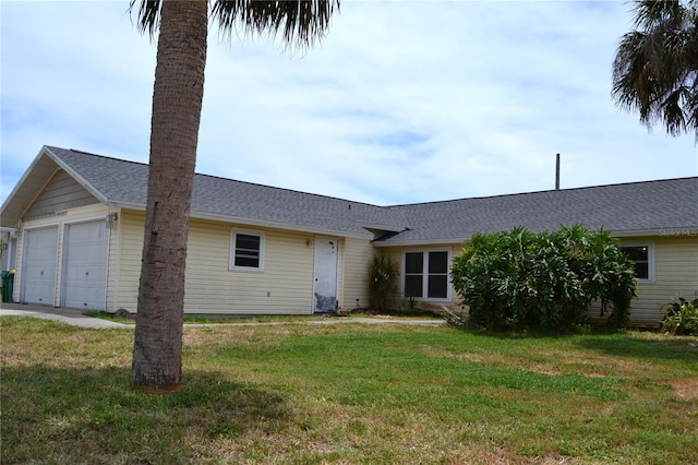 21161 Knollwood Ave, Port Charlotte, FL 33952 - view of front of property with a front yard, an attached garage, and a shingled roof