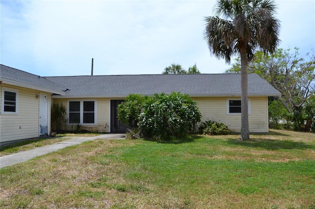 21161 Knollwood Ave, Port Charlotte, FL 33952 - ranch-style house with a front lawn