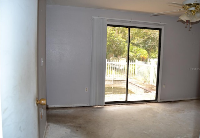 21161 Knollwood Ave, Port Charlotte, FL 33952 - empty room with unfinished concrete floors and a ceiling fan