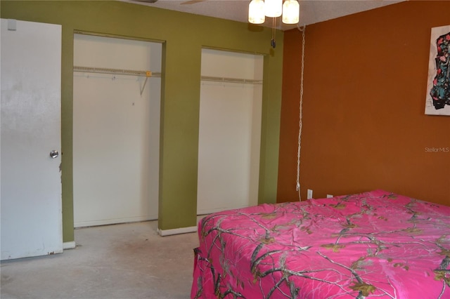 21161 Knollwood Ave, Port Charlotte, FL 33952 - bedroom featuring multiple closets and a ceiling fan