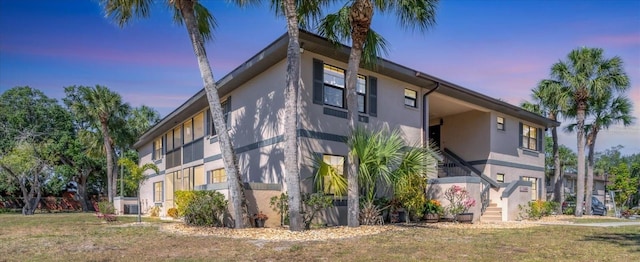 view of home's exterior with stucco siding