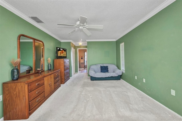 living area featuring carpet flooring, a ceiling fan, a textured ceiling, and visible vents