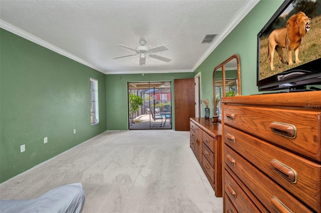 bedroom featuring visible vents, access to exterior, ornamental molding, and light carpet