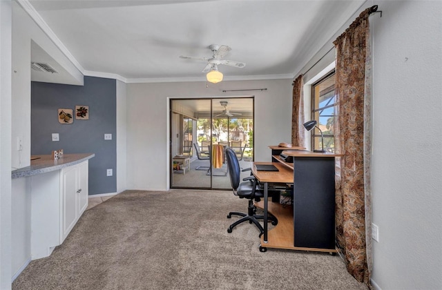 office area with a ceiling fan, visible vents, crown molding, carpet floors, and baseboards