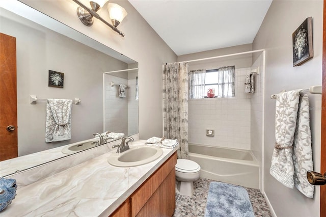 bathroom with vanity, shower / bath combo with shower curtain, and toilet