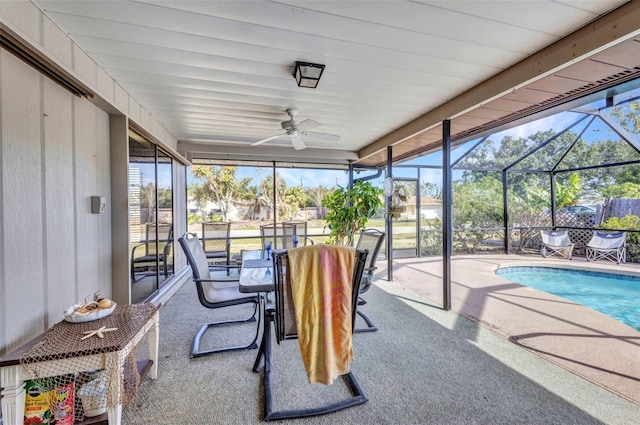 sunroom / solarium with a ceiling fan