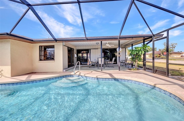 pool with a lanai, a ceiling fan, and a patio