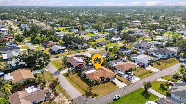 birds eye view of property with a residential view