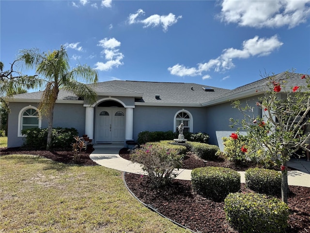 1025 Boundary Blvd, Rotonda West, FL 33947 - ranch-style house featuring a front yard and stucco siding