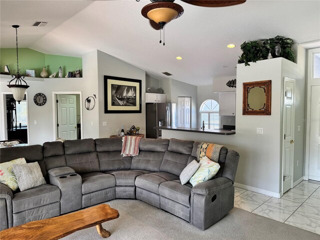 1025 Boundary Blvd, Rotonda West, FL 33947 - living room with visible vents, a ceiling fan, vaulted ceiling, and marble finish floor