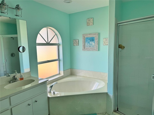 1025 Boundary Blvd, Rotonda West, FL 33947 - bathroom with vanity, a stall shower, tile patterned floors, and a bath