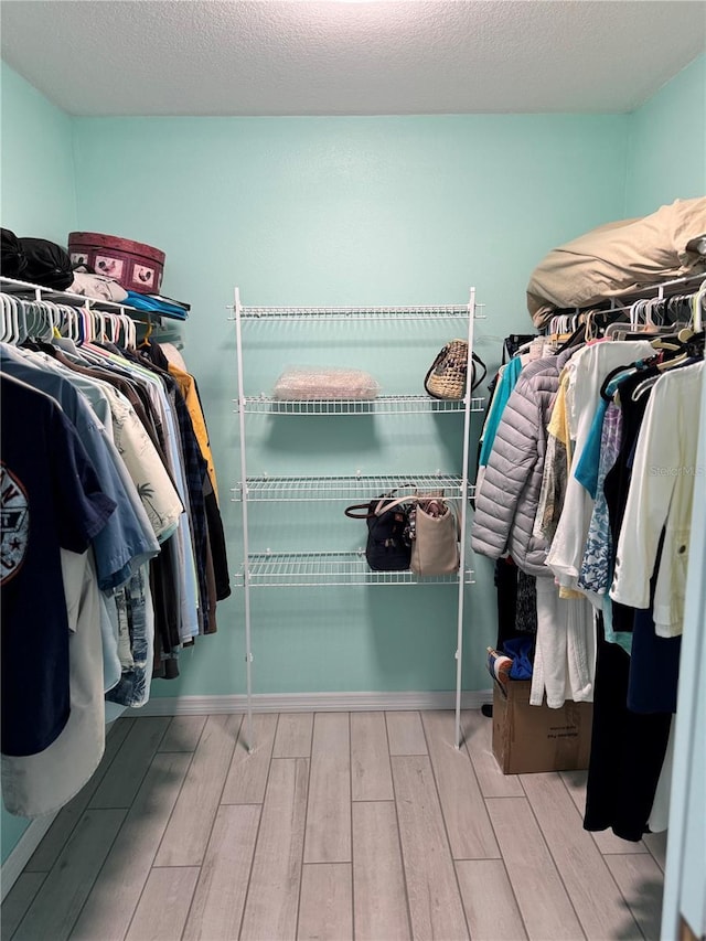 1025 Boundary Blvd, Rotonda West, FL 33947 - walk in closet featuring wood tiled floor