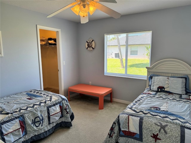 1025 Boundary Blvd, Rotonda West, FL 33947 - bedroom featuring carpet floors, a ceiling fan, baseboards, and a spacious closet