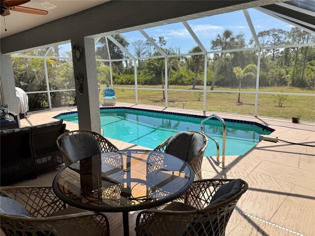 1025 Boundary Blvd, Rotonda West, FL 33947 - outdoor pool with a lawn, a lanai, ceiling fan, and a patio area