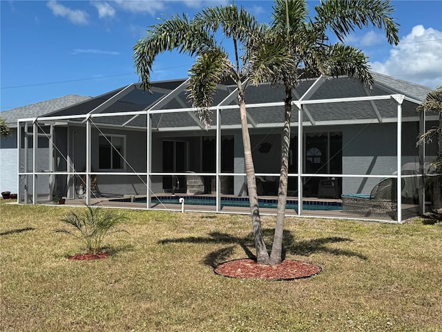 1025 Boundary Blvd, Rotonda West, FL 33947 - back of property featuring a lanai, an outdoor pool, a patio area, and a yard