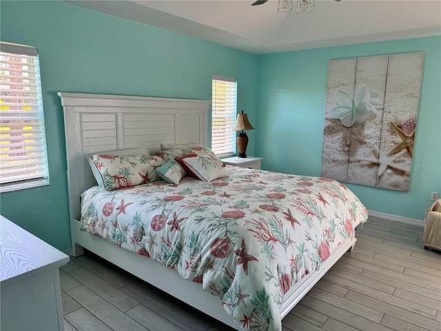 1025 Boundary Blvd, Rotonda West, FL 33947 - bedroom with a ceiling fan and wood finished floors