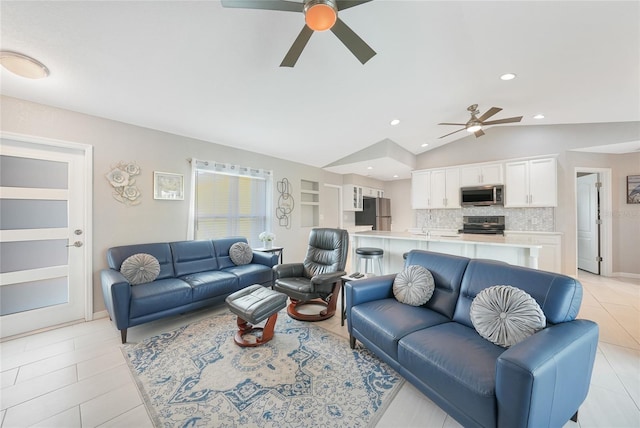living room featuring a ceiling fan, light tile patterned floors, lofted ceiling, and recessed lighting