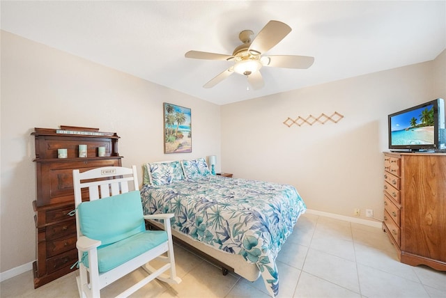 bedroom with baseboards, a ceiling fan, and light tile patterned floors
