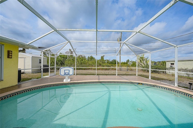 outdoor pool featuring a lanai and a patio area