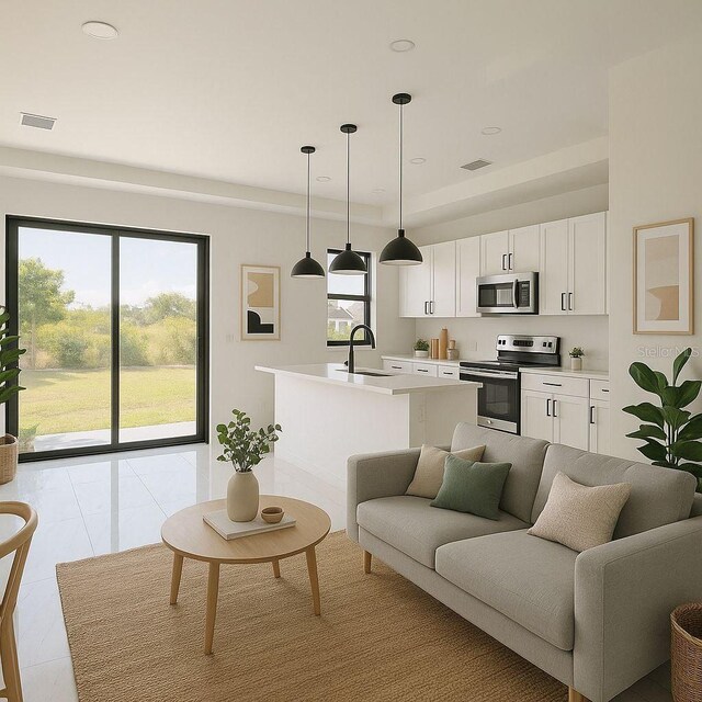 living area with light tile patterned floors, a tray ceiling, and visible vents