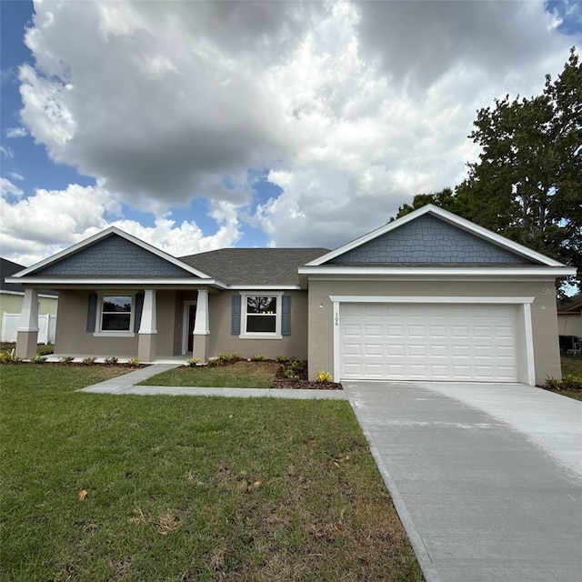ranch-style house with a garage, a front lawn, stucco siding, and driveway