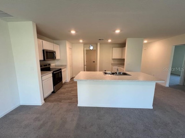 10 Ryker Ln, Palm Coast, FL 32164 - kitchen with white cabinets, stainless steel microwave, carpet flooring, and electric range