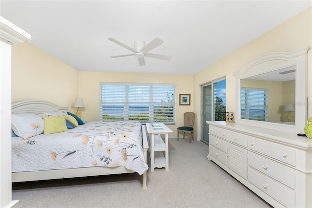 bedroom with light colored carpet and ceiling fan