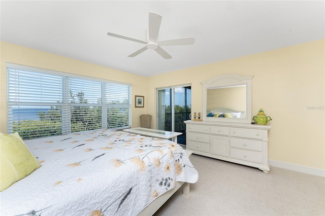 bedroom featuring light carpet, baseboards, and ceiling fan