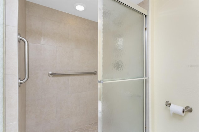 bathroom featuring a shower stall