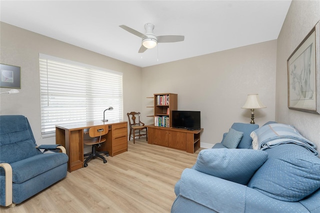 office space featuring ceiling fan and light wood-style floors