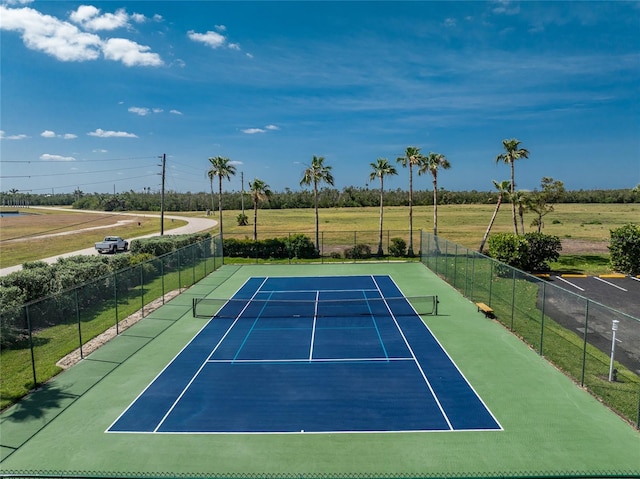 view of sport court featuring fence