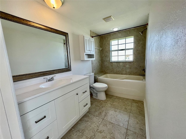 bathroom featuring toilet,  shower combination, visible vents, vanity, and a textured wall