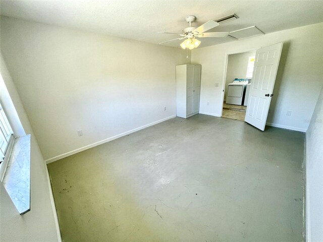 unfurnished bedroom with baseboards, ceiling fan, visible vents, washer / dryer, and concrete floors