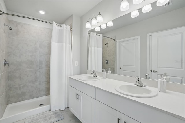 16079 Bandermill Dr, Port Charlotte, FL 33953 - full bath with a shower stall, tile patterned floors, and double vanity