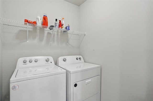 16079 Bandermill Dr, Port Charlotte, FL 33953 - washroom featuring washing machine and clothes dryer