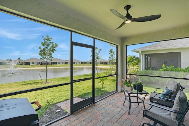 16079 Bandermill Dr, Port Charlotte, FL 33953 - sunroom featuring a water view, ceiling fan, and a residential view