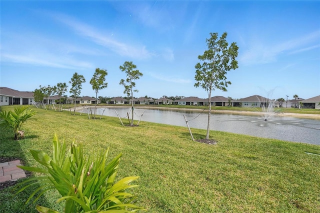16079 Bandermill Dr, Port Charlotte, FL 33953 - view of grassy yard with a residential view and a water view